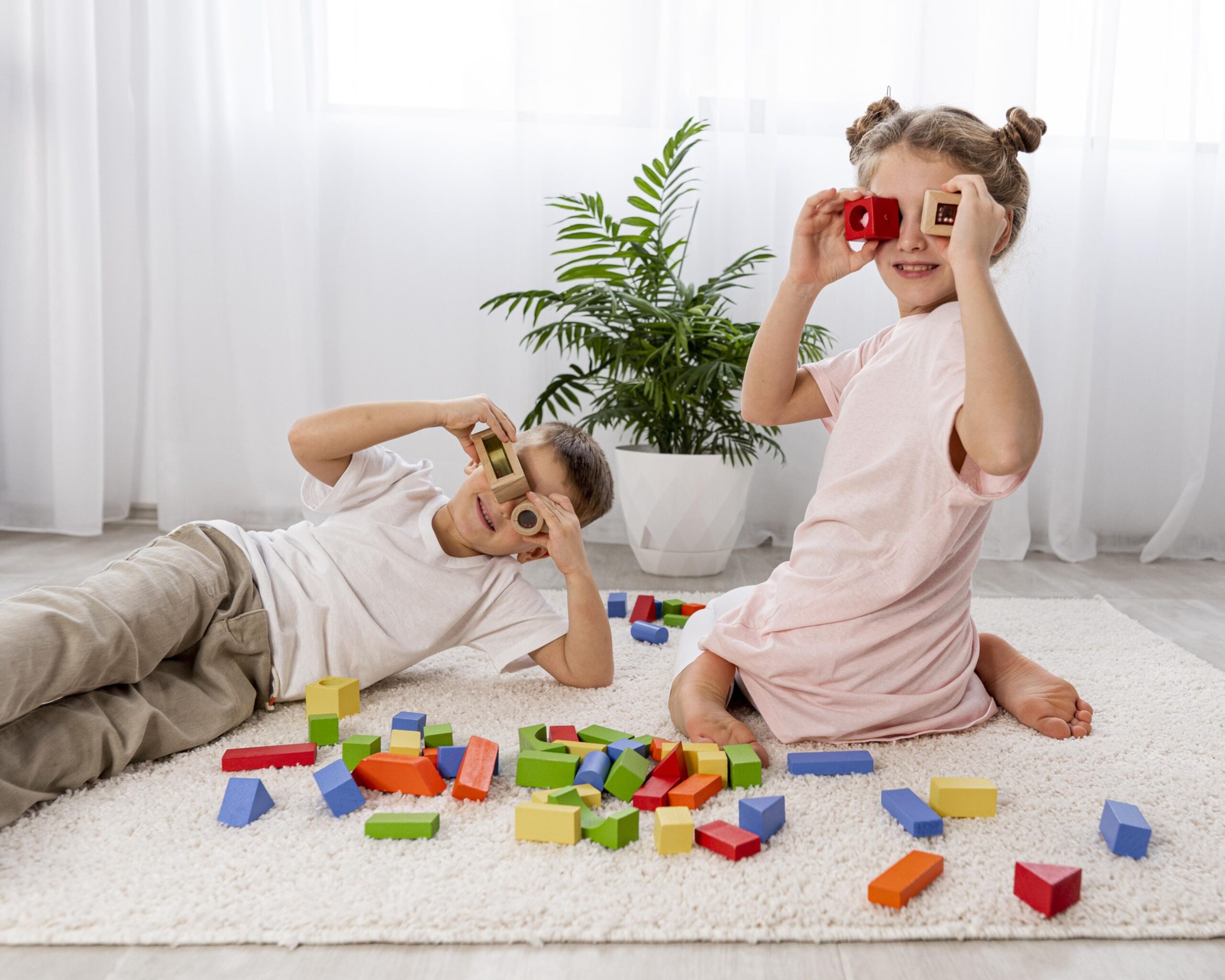 non-binary-kids-playing-with-colorful-game